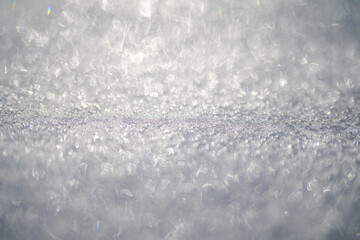 Obraz premium Winter surface with white snow and ice. Frozen backdrop with snow texture. Icy snowy surface. Snow on ground with frost and ice.