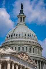 Obraz premium United States Capitol dome in Washington DC. American Capitol landmark under blue sky. Capitol Hill architecture with spring trees. Capitol symbol of democracy.