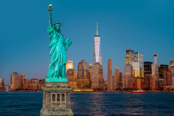 New York panorama with the Liberty Statue. NYC panoramic cityscape and Statue of Liberty. Manhattan towers and Statue of Liberty. Symbol of Freedom in USA. © Volodymyr