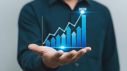 Businessman holding a 3D virtual bar chart showing growth trends