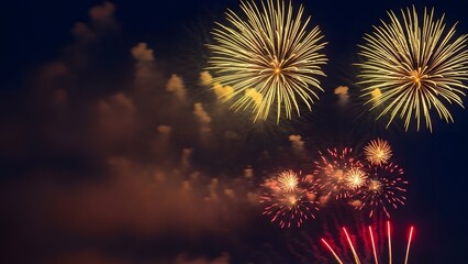 A breathtaking nighttime sky filled with vibrant fireworks bursting in full bloom. Large golden chrysanthemum-style explosions dominate the upper sky, radiating long, delicate trails of light, 