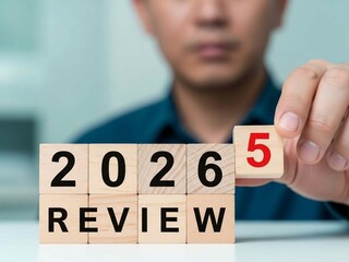 Business Review 2025 Turning Into 2026 on Wooden Blocks for Strategic Planning