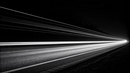 Long exposure of speeding cars on dark highway at night