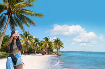Paradise Sunny beach with palms and turquoise sea. Summer vacation and tropical beach concept - Cancun, Mexico