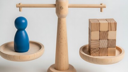 A wooden balance scale comparing a blue figure and a wooden block stack