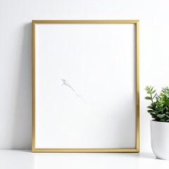 A gold framed print of minimalist art with a potted plant