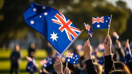 A diverse crowd waving Australian flags at an outdoor event