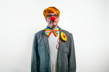 Clown in suit wearing red nose and bowtie