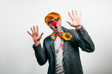 Man wearing clown costume making surprised expression