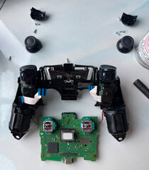 Cleaning and repairing game controller joystick, gaming maintenance and electronics repair concept