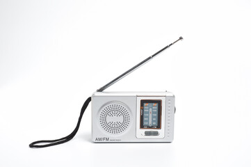 Portable battery-powered AM/FM radio photographed against a white background.