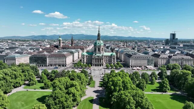 Aerial view of munich city center with st lukes church and surrounding park on a sunny day, 4k