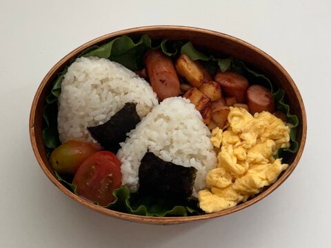 Traditional Korean dosirak lunchbox, neatly packed with rice, kimchi, stir-fried veggies, and protein. A wholesome and flavorful meal, ideal for enjoying authentic Korean flavors on the go.