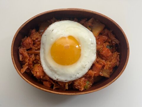 Traditional Korean dosirak lunchbox, neatly packed with rice, kimchi, stir-fried veggies, and protein. A wholesome and flavorful meal, ideal for enjoying authentic Korean flavors on the go.