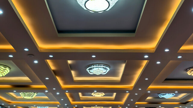 Modern Coffered Ceiling with Elegant Chandeliers, Ambient Lighting Enhances a Luxurious Interior, Coffered Ceiling Design with Recessed Lights and Ornate Chandeliers