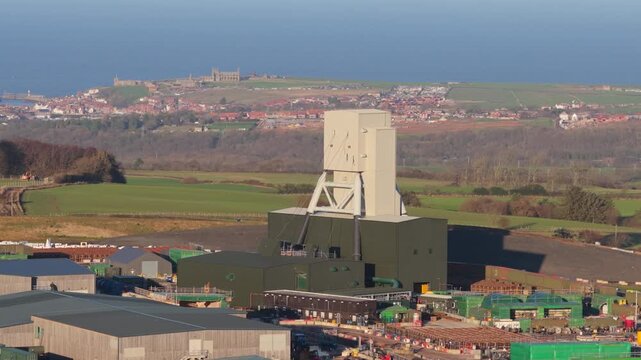 Woodsmith Mine Anglo American, Sirius, polyhalite mineral - 4k prores 422 - drone push towards mine, Whitby background - Dec 2025