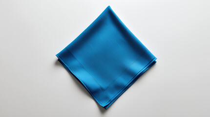 Simple blue napkin isolated on white, ideal for table setting visuals, restaurant branding, and product design