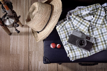 Travel theme still life with vintage items and fishing poles