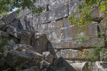 Ruins of the city of Termessos. An ancient city located high in the mountains of Turkey. The walls of the buildings in the ancient city are made of huge stone blocks. Masonry of ancient buildings.