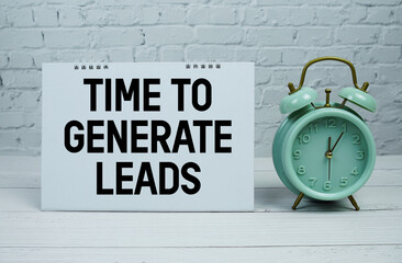 Time To Generate Leads text with Mint Green Alarm Clock on wooden Background