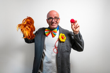 Performer with red wig and clown nose ready for show
