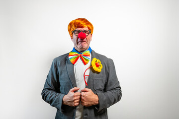 Clown experiencing sadness and crying wearing a business suit