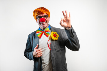 Happy clown showing ok sign and thumbs up