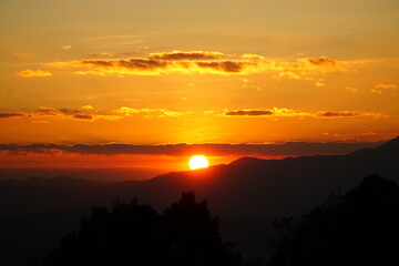 Golden Sunrise Over Misty Mountain Layers