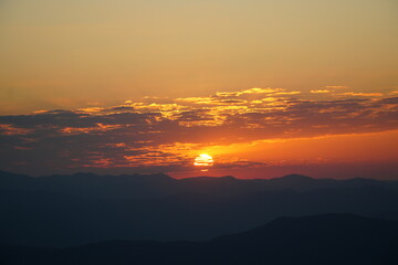 Golden Sunrise Over Misty Mountain Layers