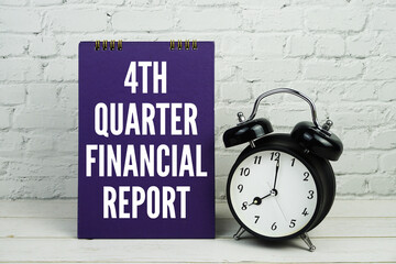 1st Quarter Financial Report text with alarm clock on white brick wall and wooden background
