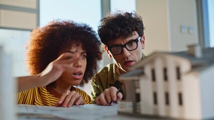Colleagues planning building architecture at construction company office closeup
