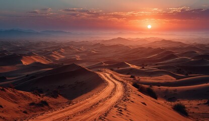 Expansive desert landscape at sunset, showcasing rolling sand dunes, winding path, and vibrant sky colors, creating a serene and tranquil atmosphere in nature's beauty