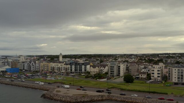 Aerial glide from Galway Bay toward the Salthill coastline, Ireland.
