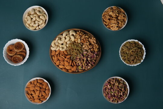 Healthy mixed dry fruits assortment featuring a nutritious blend of almonds, cashews, pistachios, walnuts, raisins, and dates. Rich in natural energy, vitamins, and minerals, this dry fruit mix is wid