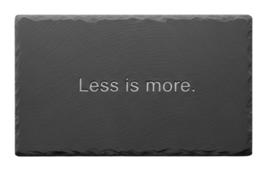 Minimalist design statement 'less is more on slate plate isolated on transparent background