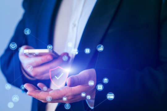 Person using smartphone to access digital security features with symbolic icons in a modern office setting - Powered by Adobe