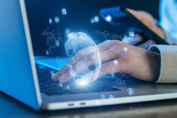 Engaging in digital technology, connecting globally through a laptop and smartphone