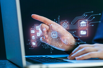 Innovative technology showcases AI interface on laptop screen with hand gesture at a modern workspace