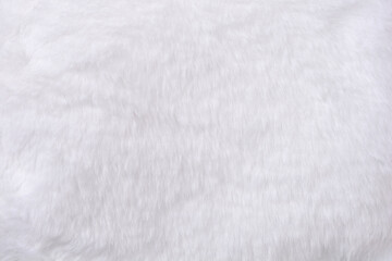Fototapeta premium A full frame close up shot showcasing the soft and fluffy texture of clean white synthetic faux fur material
