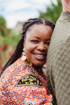 Smiling woman embracing her husband in Kstate Gardens