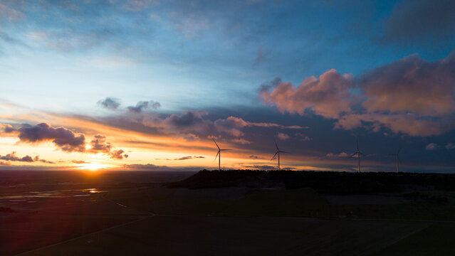 Wind Turbines on Hill at Sunset, Renewable Energy Landscape