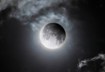 Night Sky Showing Partial Lunar Eclipse and Cloud Cover