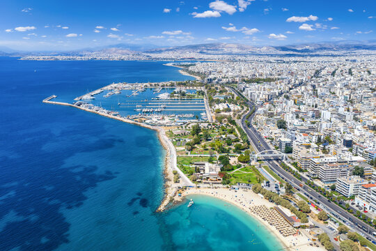 Aerial view of the Alimos district in southern Riviera in Athens, Greece, with boat marina and beaches next to the urban skyline