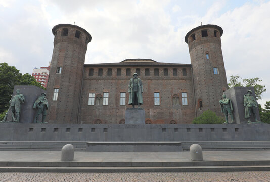 Turin, TO, Italy - June 3, 2025: piazza castello and monument to emanuele filiberto duke of aosta in front of the tall towers of palazzo madama
