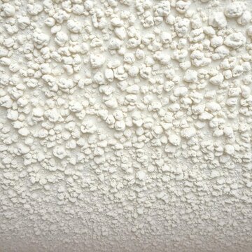 Slightly bumpy popcorn ceiling reveals a classic, textured finish ideal for home renovation,  texture,  bumpy