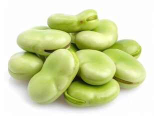Close-up of a pile of plump, light green broad beans on white