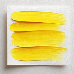 Vibrant yellow brush strokes on watercolor paper background for creative design projects