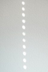 Empty white cement wall room interior background with circle shadow from window.