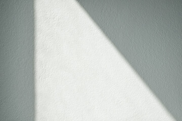 Empty white cement wall room interior background with shadow from window.