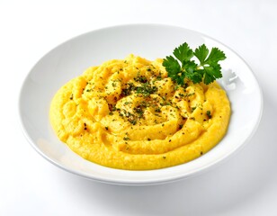 Creamy yellow dish in a white bowl with herbs